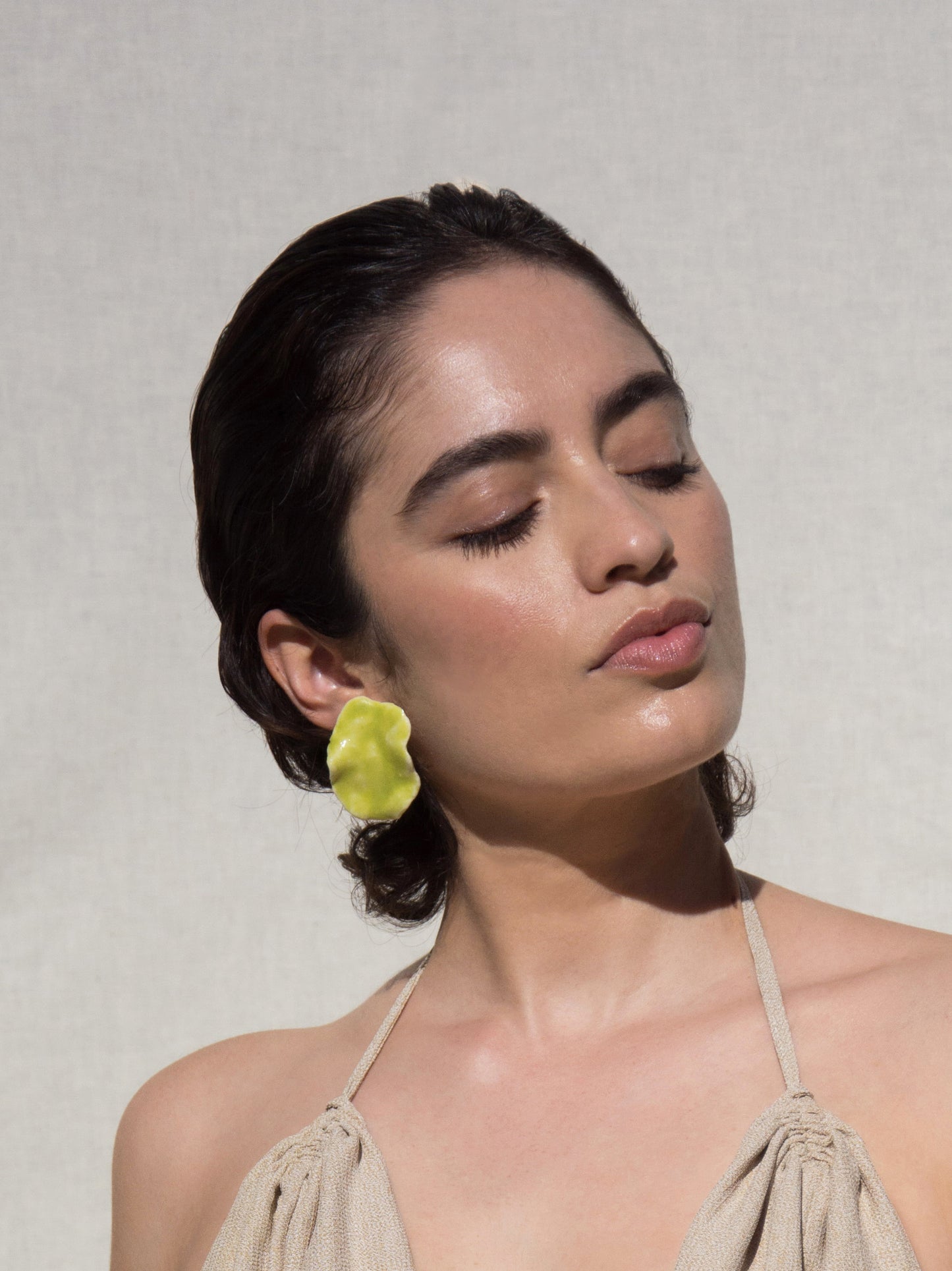 Model wearing Green Earring.